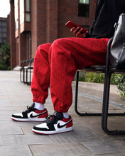 Load image into Gallery viewer, Patterned &#39;Red Q&#39; Pair - [Pairs UK] [jogging bottoms] [ are those pairs] [mike pairs] [sweatpants] [patterned sweatpants] [patterned pants] 